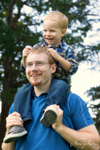 Boy on father's shoulders