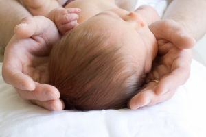 Newborn in father's hands