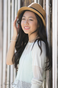 Senior back against striped wall