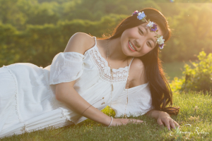 boho senior picture lying on grass