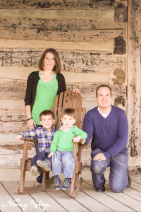 family on cabin porch