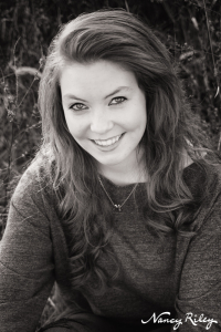 Senior sitting in field