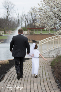 First Communion girl and dad