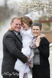 First Communion girl and parents