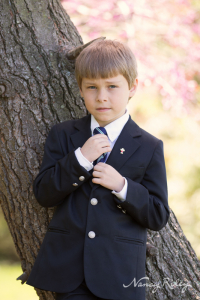First Communion Andrew straightening tie