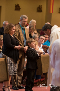 First Communion Andrew with parents