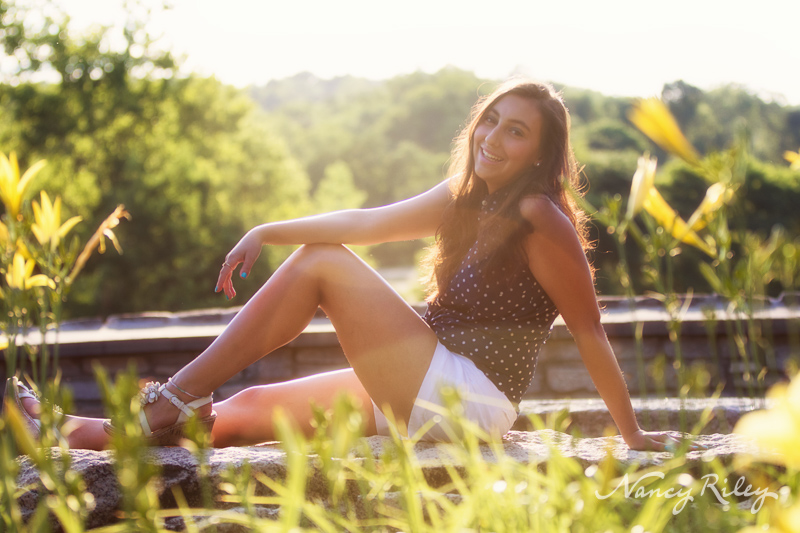 Senior seated with sun flare