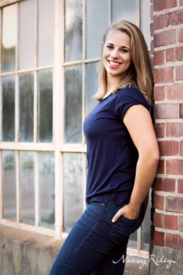 Senior girl by windows