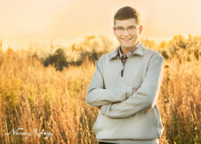 Senior boy by field
