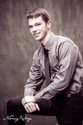 Senior boy with textured wall
